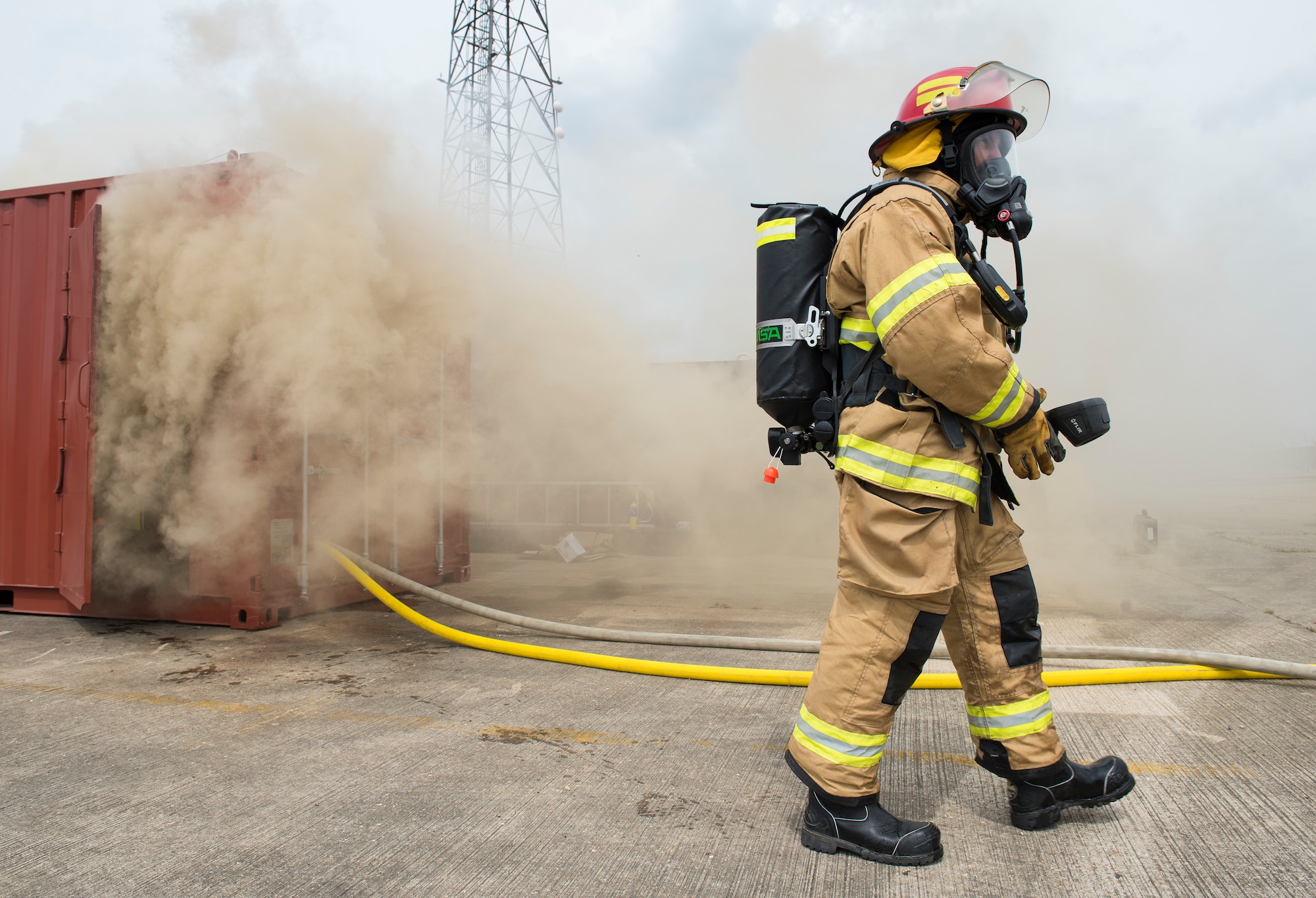 RAF Alconbury firefighters use new fire behavior trainer to practice techniques for safely fighting fires at RAF Alconbury, England, July 17, 2019. (U.S. Air Force photo by Airman 1st Class Jennifer Zima)