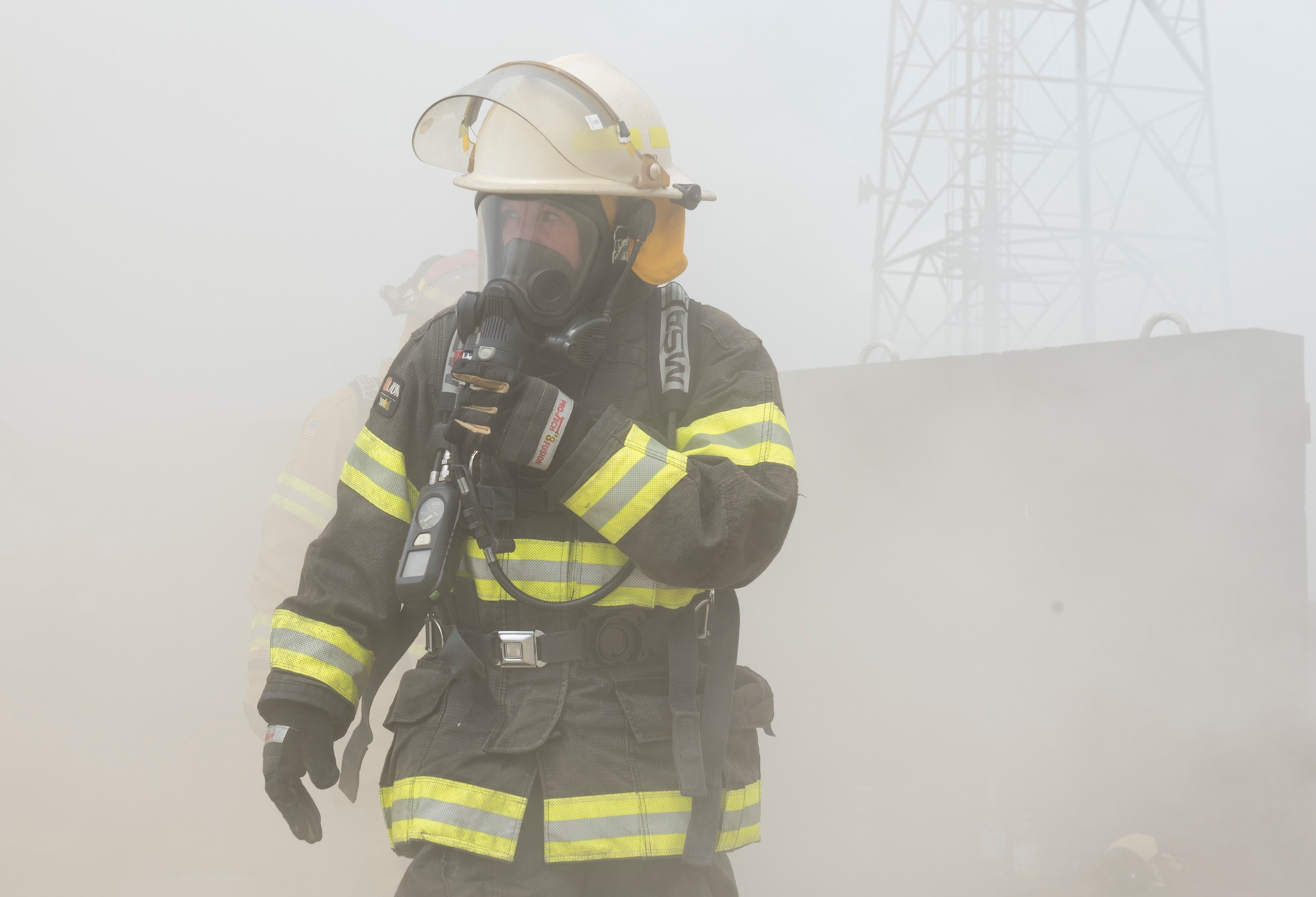 RAF Alconbury firefighters use new fire behavior trainer to practice techniques for safely fighting fires at RAF Alconbury, England, July 17, 2019. (U.S. Air Force photo by Airman 1st Class Jennifer Zima)