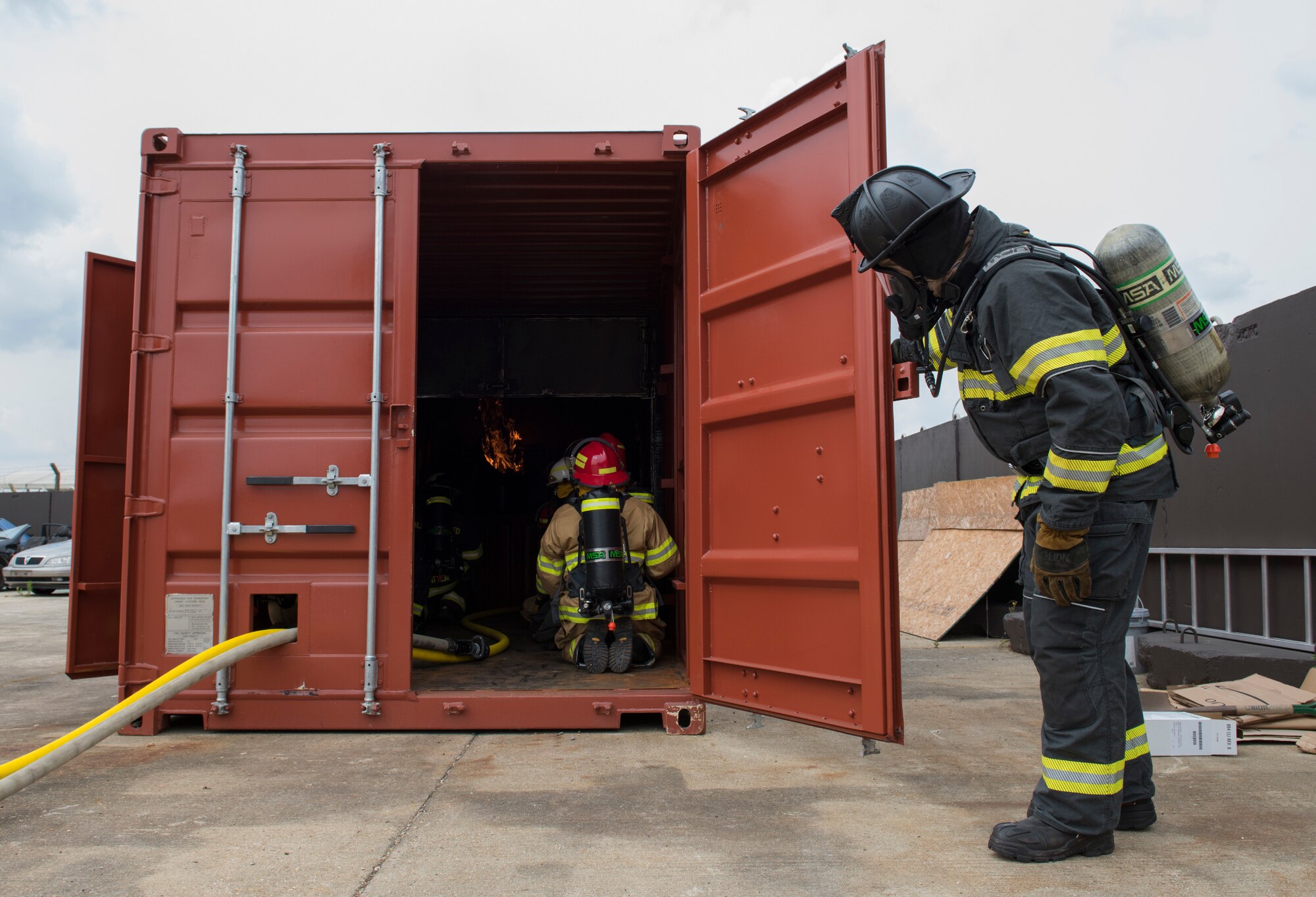 RAF Alconbury firefighters use new fire behavior trainer to practice techniques for safely fighting fires at RAF Alconbury, England, July 17, 2019. (U.S. Air Force photo by Airman 1st Class Jennifer Zima)