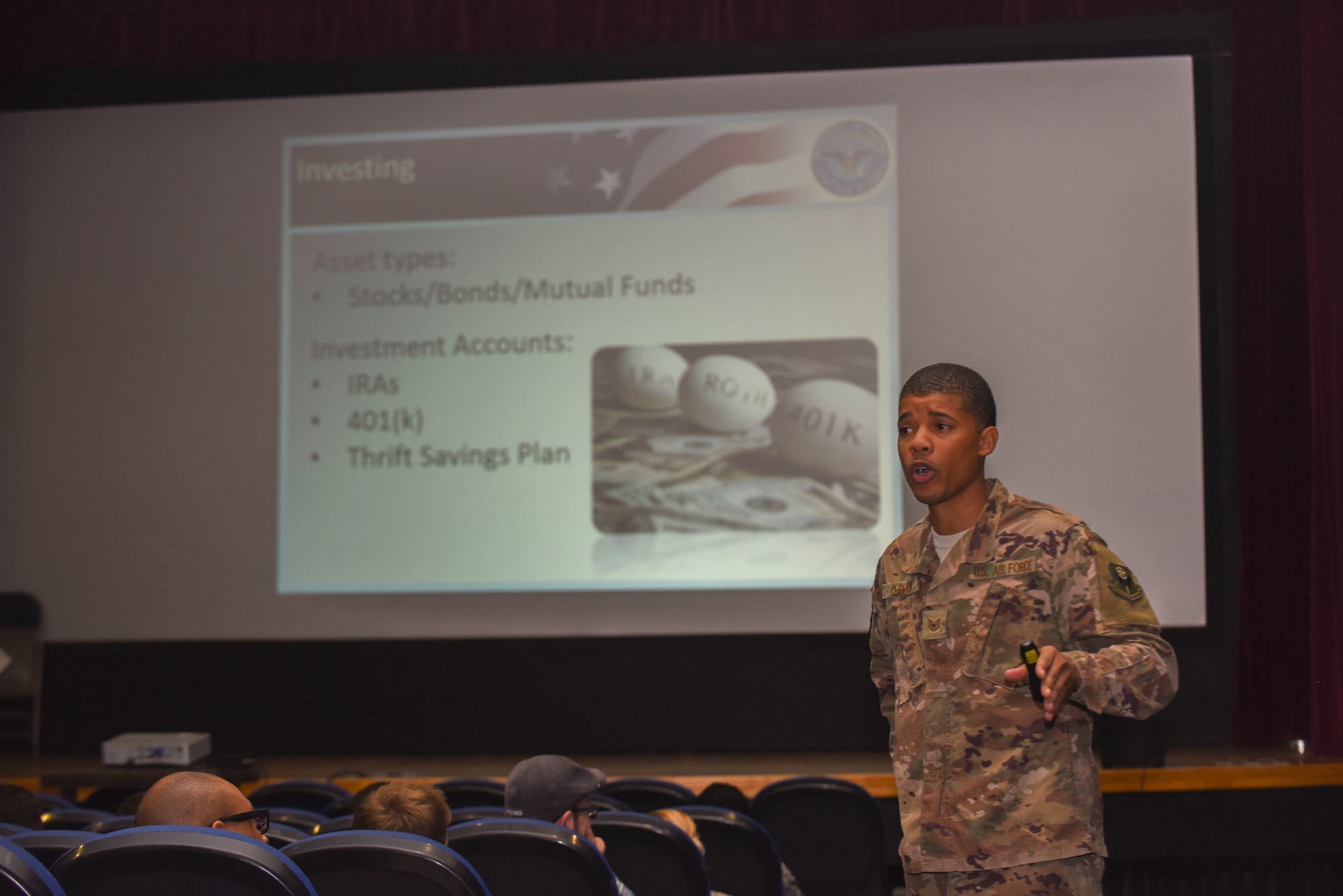 U.S. Air Force Tech. Sgt. Skylar DeRouen, 752nd Special Operations Aircraft Maintenance Squadron resource advisor, speaks to Airmen about basic investing principles at RAF Mildenhall, England, July 16, 2019. Airmen attended the professional development course, which was taught by DeRouen and the base personal financial counselor. (U.S. Air Force photo by Airman 1st Class Joseph Barron)