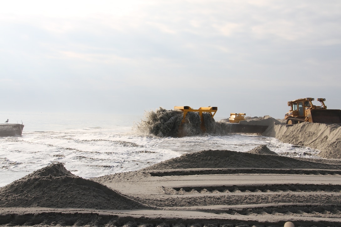 In 2013, USACE completed periodic nourishment of the Cape May to Lower Township project. Sand is pumped through a basket on the beach as part of a screening system.