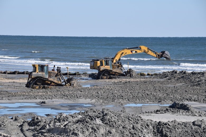 Construction equipment pushes sand into an engineered beach template as part of the 2017 periodic nourishment of the Cape May to Lower Township project.