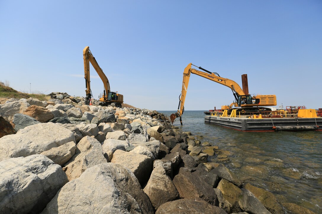 Large rocks are placed at the expansion site in April 2016 to armor dikes that will eventually contain dredged material from the approach channels to the Port of Baltimore.