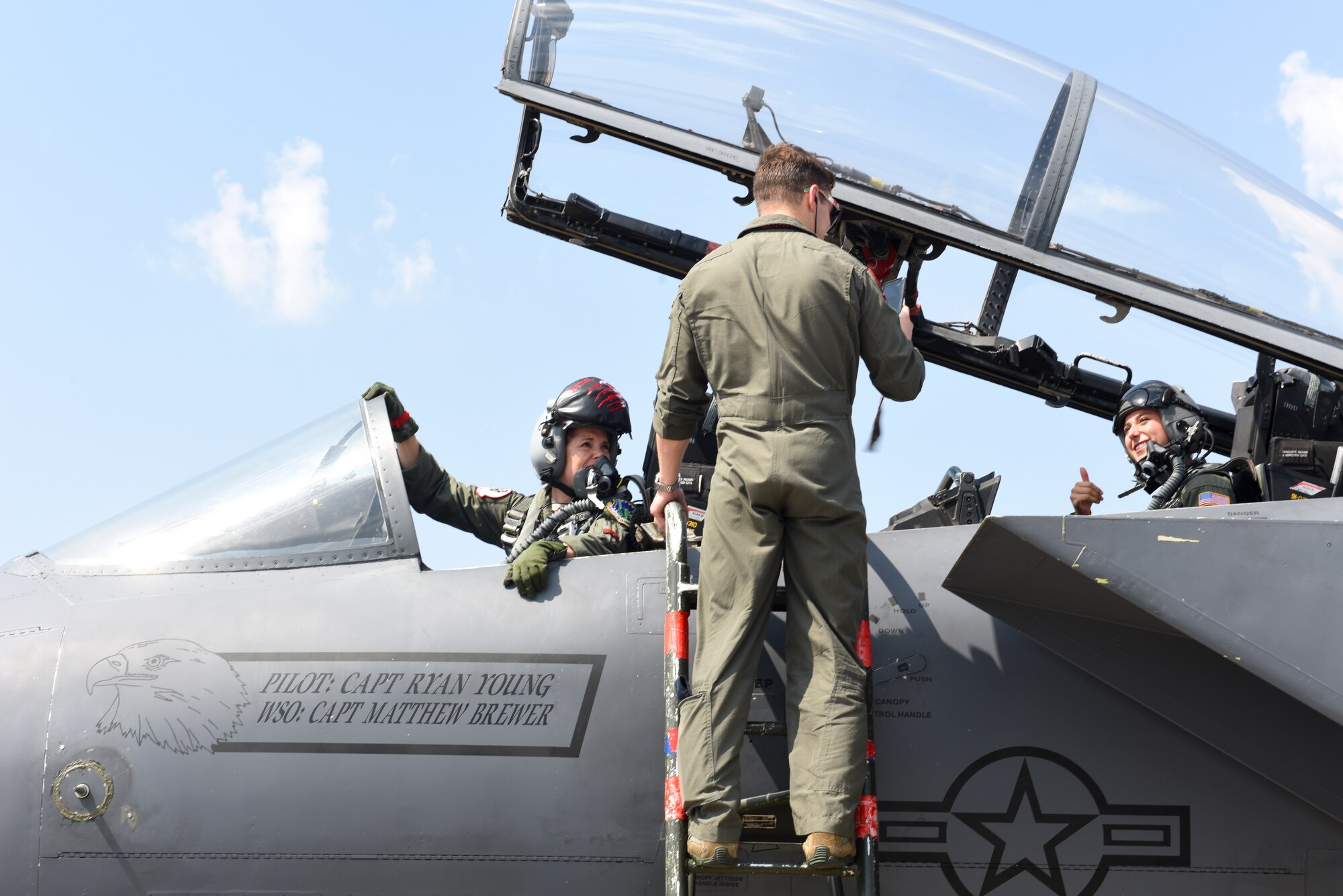 Pilots assigned to the 492nd Fighter Squadron and a U.S. Air Force Academy cadet prepare for a familiarization flight at Royal Air Force Lakenheath, England, July 26. The cadets are participating in “Operation Air Force,” a two-week program in which they are able to see and experience the Air Force mission being accomplished first-hand. (U.S. Air Force photo by Airman 1st Class Rhonda Smith)