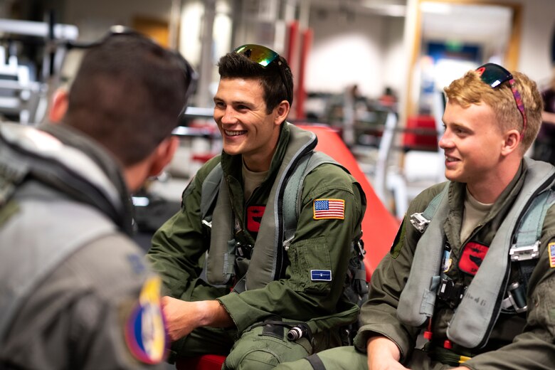 U.S. Air Force Academy cadets speak with 48th Fighter Wing pilots prior to their familiarization flight with the 494th Fighter Squadron at Royal Air Force Lakenheath, England, July 26. The cadets are participating in “Operation Air Force,” a two-week program in which they are able to see and experience the Air Force mission being accomplished first-hand. (U.S. Air Force photo by Senior Airman Malcolm Mayfield)