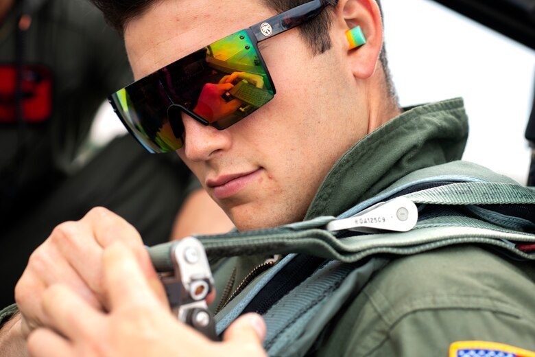 A U.S. Air Force Academy cadet secures himself into an F-15E Strike Eagle assigned to the 494th Fighter Squadron in preparation for a familiarization flight at Royal Air Force Lakenheath, England, July 26. The cadets are participating in “Operation Air Force,” a two-week program in which they are able to see and experience the Air Force mission being accomplished first-hand. (U.S. Air Force photo by Senior Airman Malcolm Mayfield)