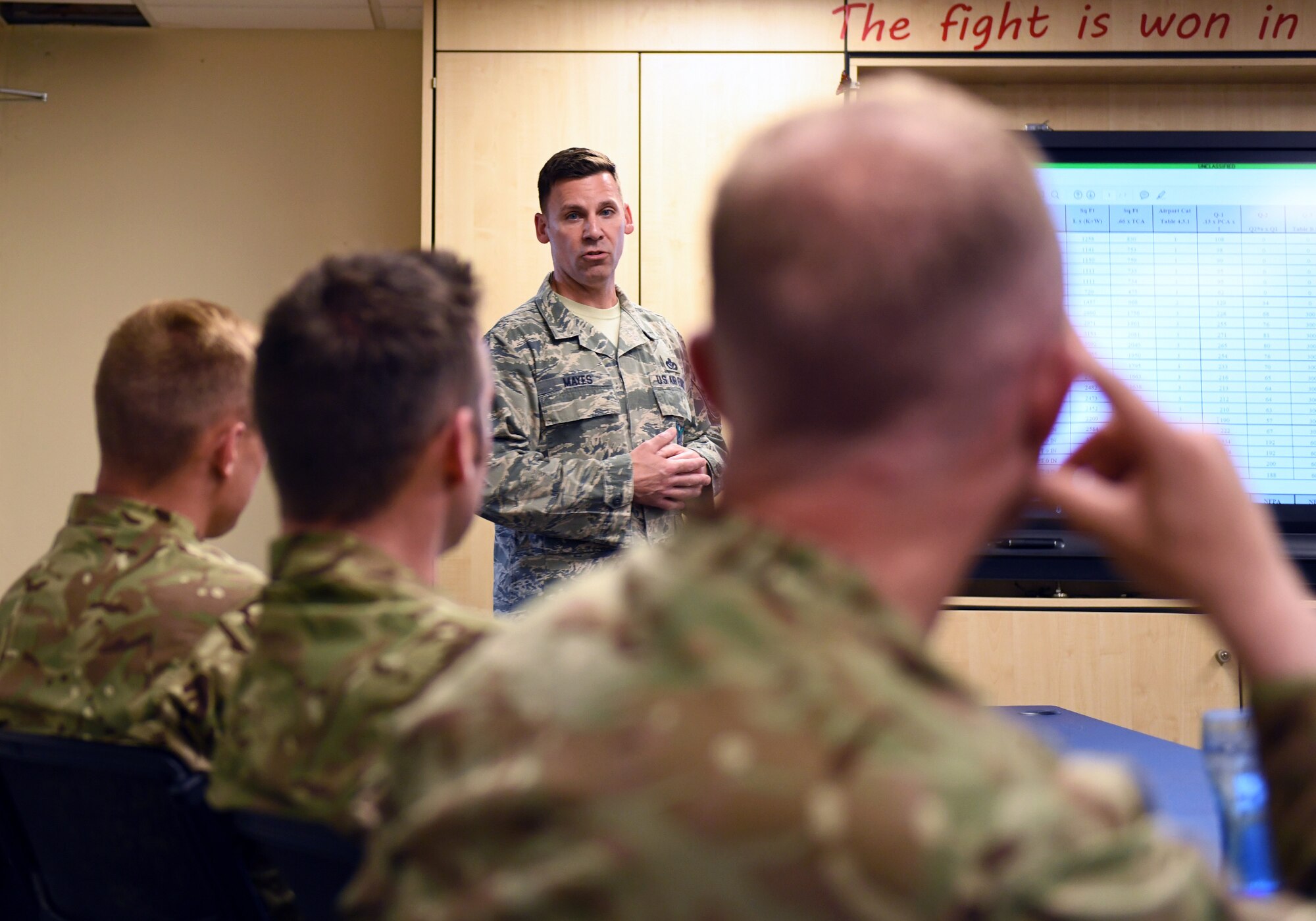 U.S. Air Force Master Sgt. Roscoe Mayes, 48th Civil Engineer Squadron Fire Department fire company officer, trains Royal Air Force Waddington personnel on fire rescue procedures for the F-15 platform at Royal Air Force Lakenheath, England, July 25, 2019. Eight Fire Service members from RAF Waddington visited the base to learn firsthand the procedures, protocols, hazards and risks associated with taking care of an emergency involving an F-15 from their U.S. counterparts. (U.S. Air Force photo by Staff Sgt. Alex Fox Echols III)