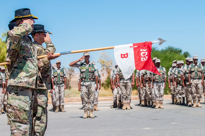 New Jersey National Guard Soldiers, with 1st Squadron, 102nd Calvary Regiment, and Jordan Border Guard Force Soldiers, with the 7th Mechanized Battalion, 48th Mechanized Brigade, render a salute to the Jordanian and American National Anthems during the Jordan Operational Engagement Program (JOEP) opening ceremony July 14, 2019. JOEP is a 14-week individual and collective training, as well as a military partnership between Jordan and America.