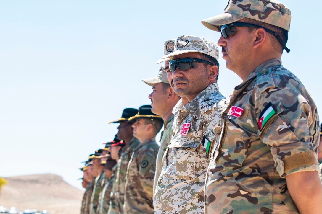 New Jersey National Guard Soldiers, with 1st Squadron, 102nd Calvary Regiment, and Jordan Border Guard Force Soldiers, with the 7th Mechanized Battalion, 48th Mechanized Brigade, participate in the Jordan Operational Engagement Program (JOEP) opening ceremony July 14, 2019. JOEP is a 14-week individual and collective training, as well as a military partnership between Jordan and America.