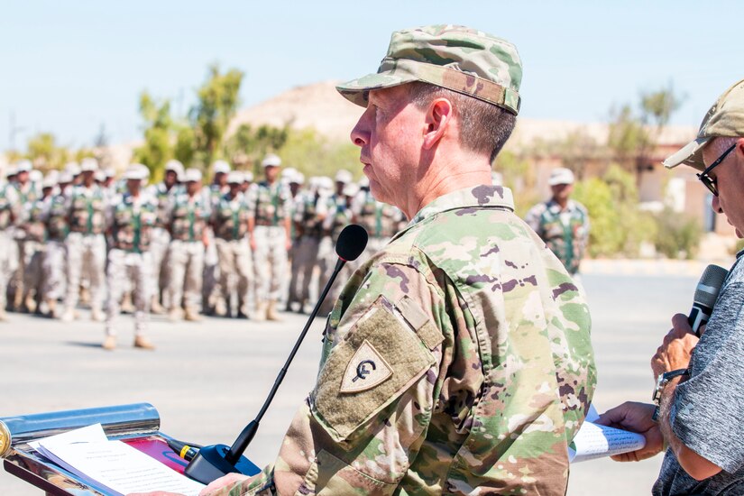 U.S. Army Col. Kirk White, senior Army leader of Jordan, speaks to New Jersey National Guard Soldiers, with 1st Squadron, 102nd Calvary Regiment, and Jordan Border Guard Force Soldiers, with the 7th Mechanized Battalion, 48th Mechanized Brigade, on behalf of Task Force Spartan-Jordan at the Jordan Operational Engagement Program (JOEP) opening ceremony July 14, 2019. JOEP is a 14-week individual and collective training, as well as a military partnership between Jordan and America.