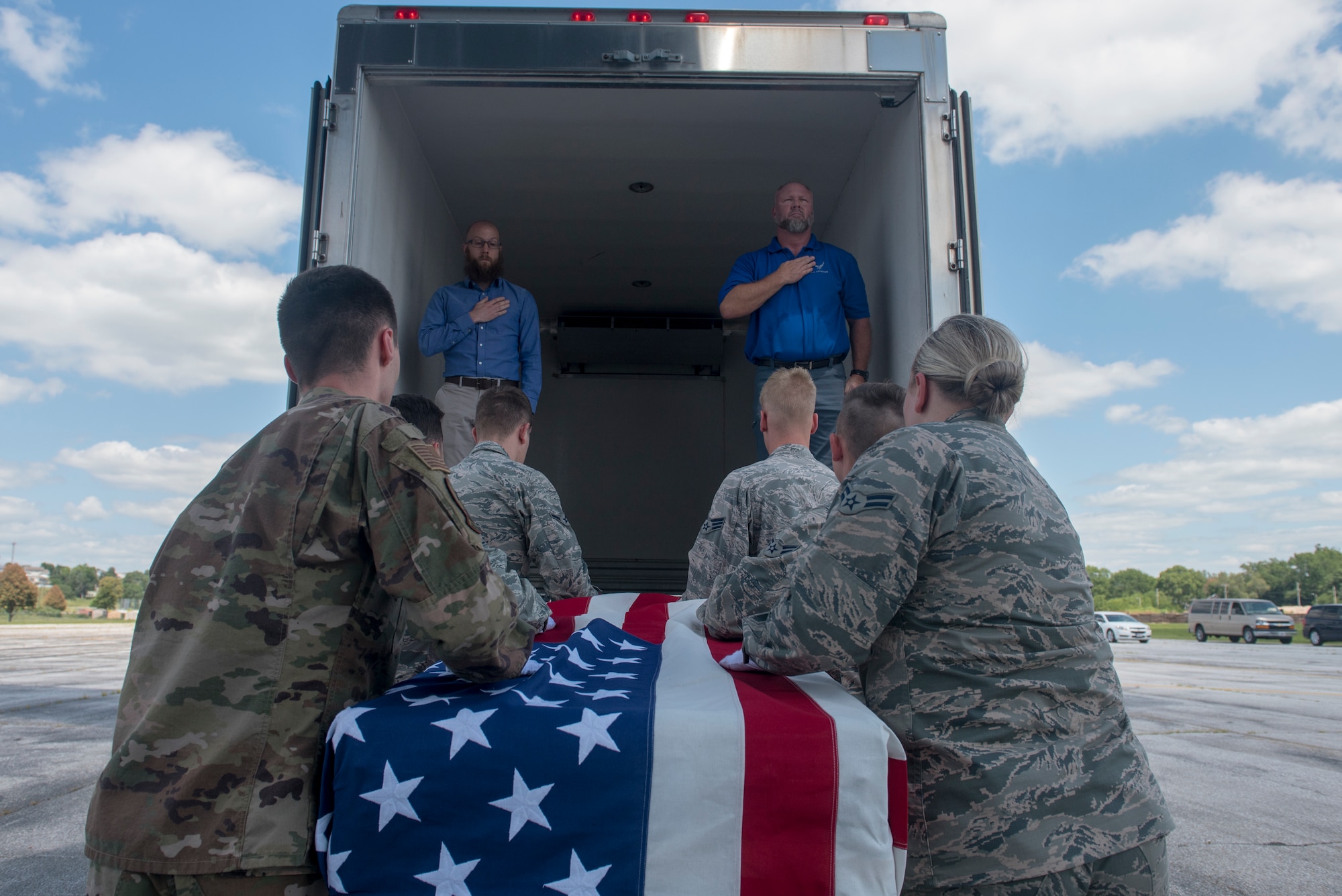 A team of Offutt Honor Guardsmen load a casket containing the remains of a World War II service member onto a truck for transportation to the Defense POW/MIA Accounting Agency here during a dignified transfer July 23, 2019. For additional images of the transfer, visit https://www.flickr.com/photos/offutt_afb/albums/72157709886860852