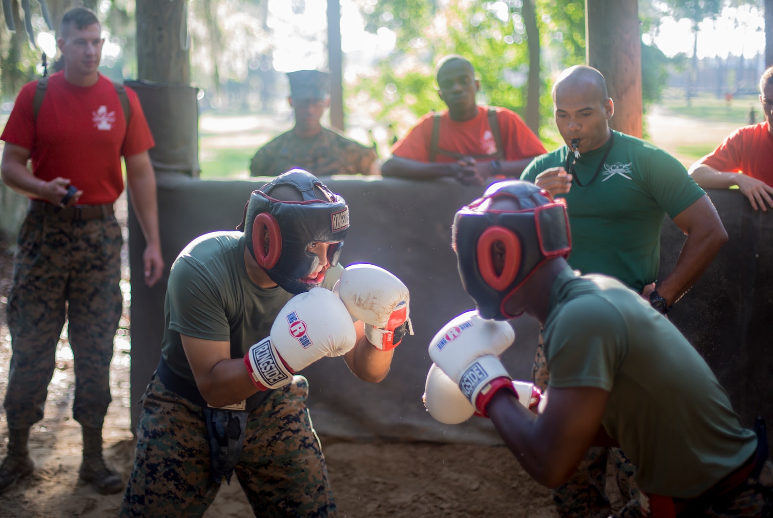Recruits with Delta Company, 1st Recruit Training Battalion, practice the fundamentals of body sparring on Marine Corps Recruit Depot Parris Island, S.C., July 25, 2019. Body sparring is an exercise that exemplifies the fundamentals of Marine Corps Martial Arts and forces recruits to overcome physical and mental fatigue. (U.S. Marine Corps photo by Lance Cpl. Dylan Walters)