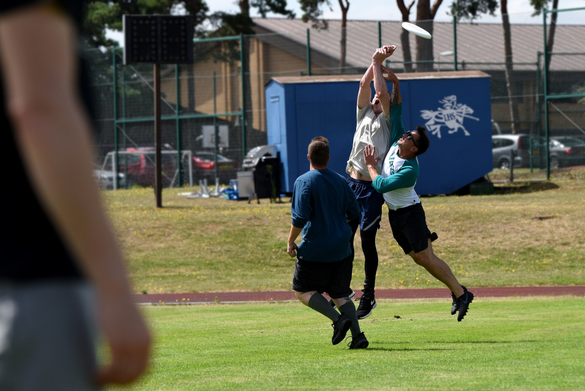 U.S. Airmen assigned to the 48th Mission Support Group compete in a game of ultimate frisbee during the annual 48th MSG Olympics at Royal Air Force Lakenheath, England, July 22, 2019. Events included inflatable obstacle courses, tug of war, ultimate frisbee and more moral building exercises. (U.S. Air Force photo by Airman 1st Class Madeline Herzog)