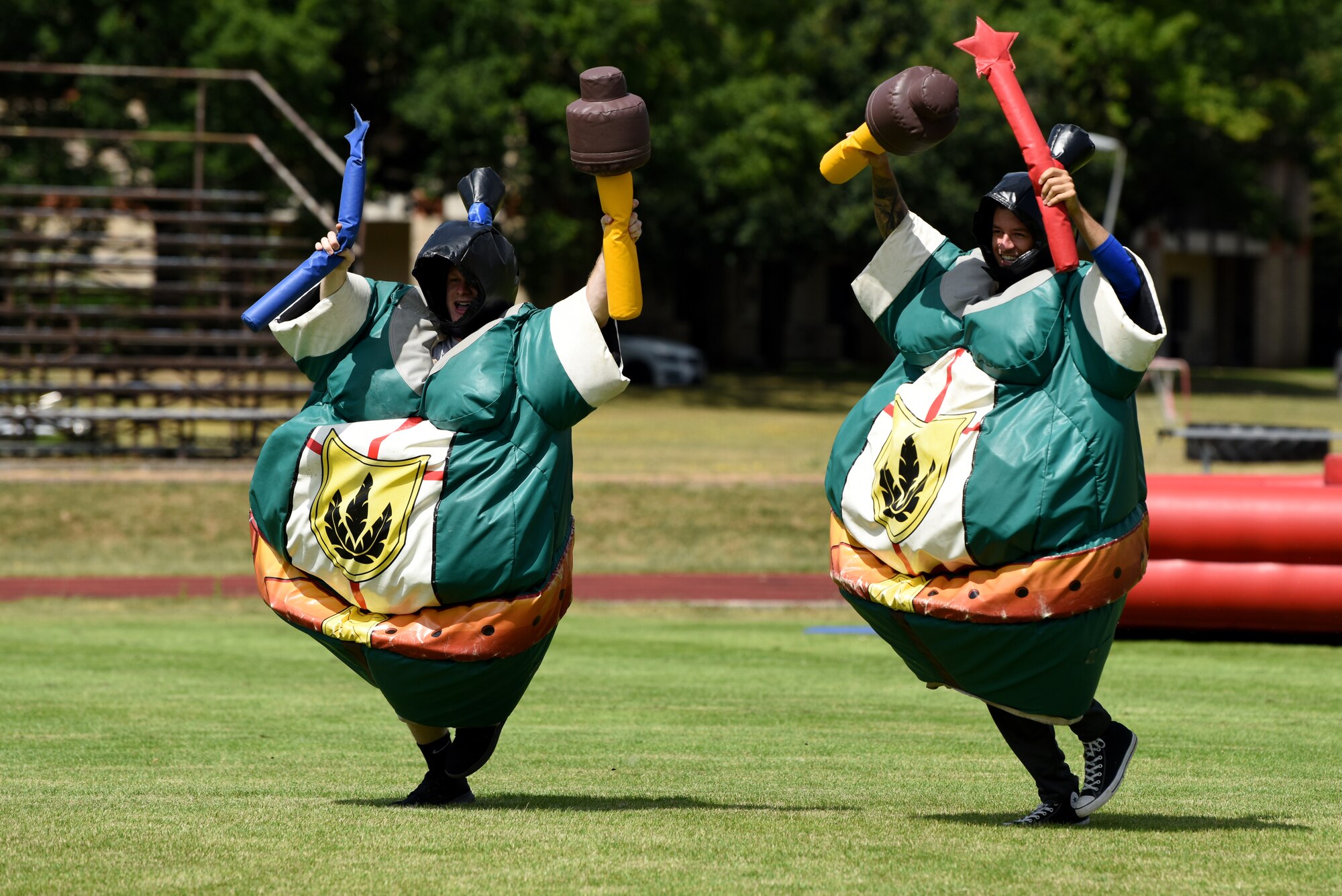 U.S. Airmen assigned to the 48th Mission Support Group compete in a body suit race during the 48th MSG Olympics at Royal Air Force Lakenheath, England, July 22, 2019. Each 48th MSG squadron formed teams to participate in the games and events throughout the day building resilience through cooperation.  (U.S. Air Force photo by Airman 1st Class Madeline Herzog)