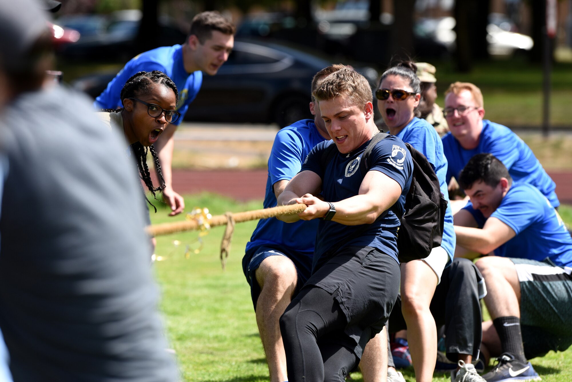 U.S. Airmen assigned to the 48th Mission Support Group participate in tug of war during the 48th MSG Olympics at Royal Air Force Lakenheath, England, July 22, 2019. Airmen and their families enjoyed food, music and resiliency events, such as ultimate frisbee and tug of war.  (U.S. Air Force photo by Airman 1st Class Madeline Herzog)