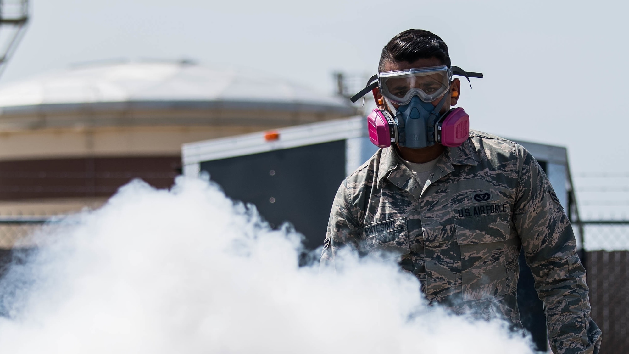 Airman 1st Class Alberto Montesino, a 2nd Civil Engineer Squadron pest management apprentice, deploys a mosquito fogger at Barksdale Air Force Base, June 25, 2019. The 2nd CES pest management shop regularly uses the fogger for mosquitoes, as well as tests for mosquito-borne diseases such as the West Nile virus and the Zika virus. (U.S. Air Force photo by Airman Jacob B. Wrightsman)