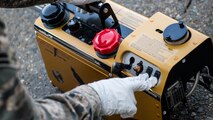Airman 1st Class Alberto Montesino, a 2nd Civil Engineer Squadron pest management apprentice, turns on a mosquito fogger at Barksdale Air Force Base, Louisiana, June 25, 2019. Along with fogging mosquitoes, pest management also conducts standing water surveys to find and deal with possible mosquito breeding grounds. (U.S. Air Force photo by Airman Jacob B. Wrightsman)