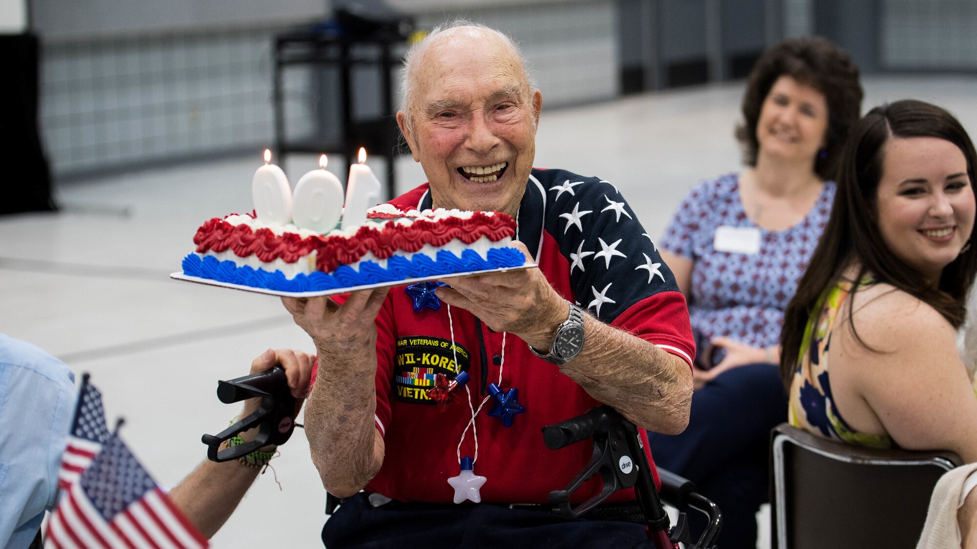 Retired Col. Steven L. dePyssler, 2nd Missions Support Group retiree affairs director, holds his birthday cake during his 100th birthday celebration at the Bossier City Civic Center, Bossier City, Louisiana, July 19, 2019. dePysssler was born July 21, 1919 in Chicago, Illinois. (U.S. Air Force photo by Airman Jacob B. Wrightsman)
