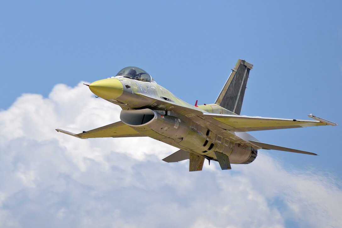 Lt. Col. Beau “Strap” Wilkins, 514th Flight Test Squadron test pilot, flies a low approach over taxiway Alpha in an unpainted U.S. Air Force Thunderbird F-16 Fighting Falcon during a functional check flight at Hill Air Force Base, Utah, July 1, 2019 (U.S. Air Force photo by Alex R. Lloyd)