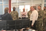 civilian and military personnel talk