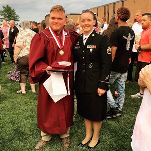 Staff Sgt. Ashley Munger, AGR Army recruiter, Shellbyville Recruiting Station, Indiana, with her Future Soldier at his college  graduation.
