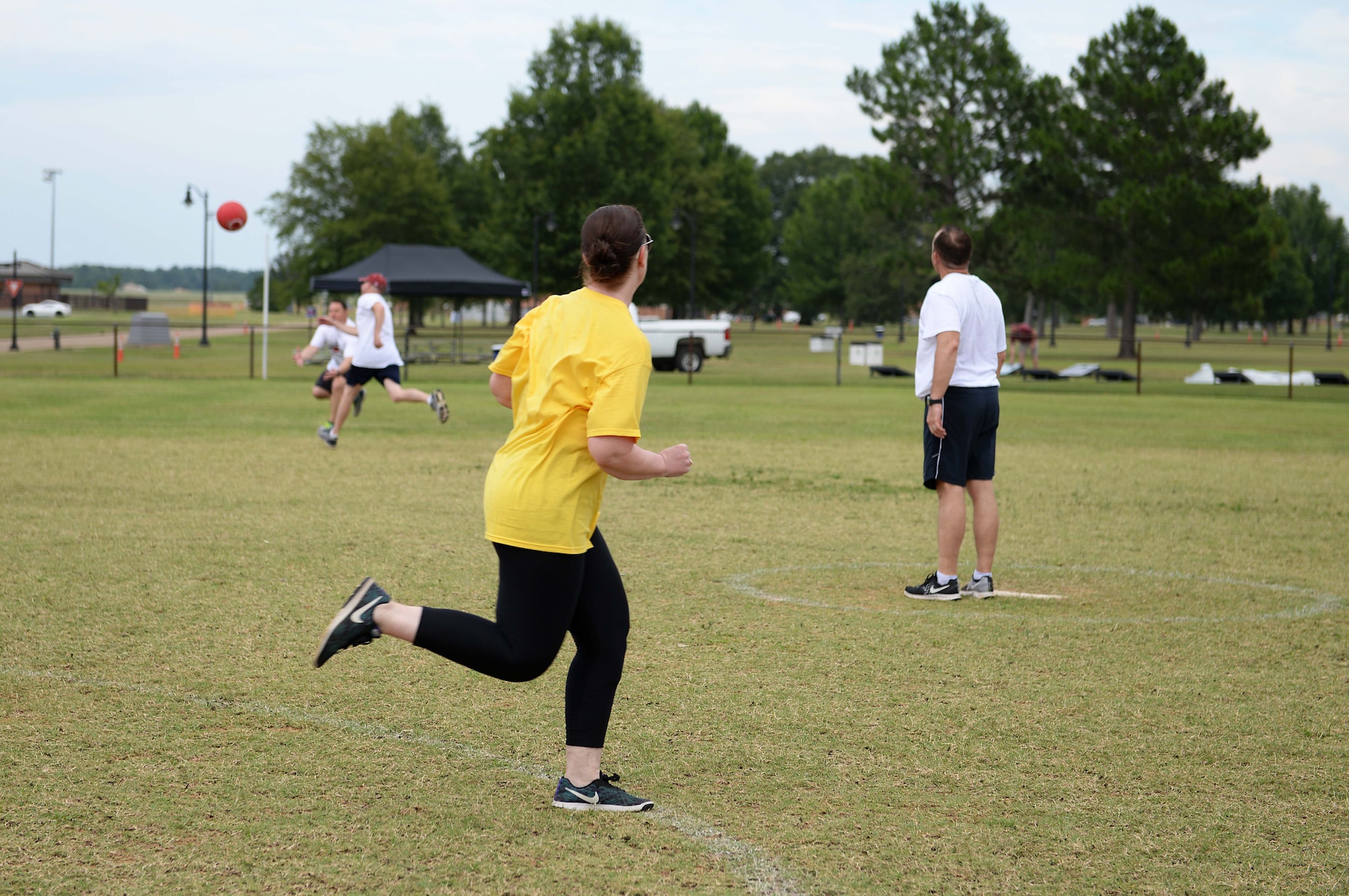 Master Sgt. Jacelyn Jesseph, 14th Comptroller Squadron superintendent, runs toward a base during the Eagles versus the Chiefs kickball game July 3, 2018, at BLAZE Fest on Columbus Air Force Base, Miss. BLAZE Fest kicked off with a kickball game, in which the eagles defeated the chiefs 2-1. (U.S. Air Force photo by Airman 1st Class Hannah Bean)