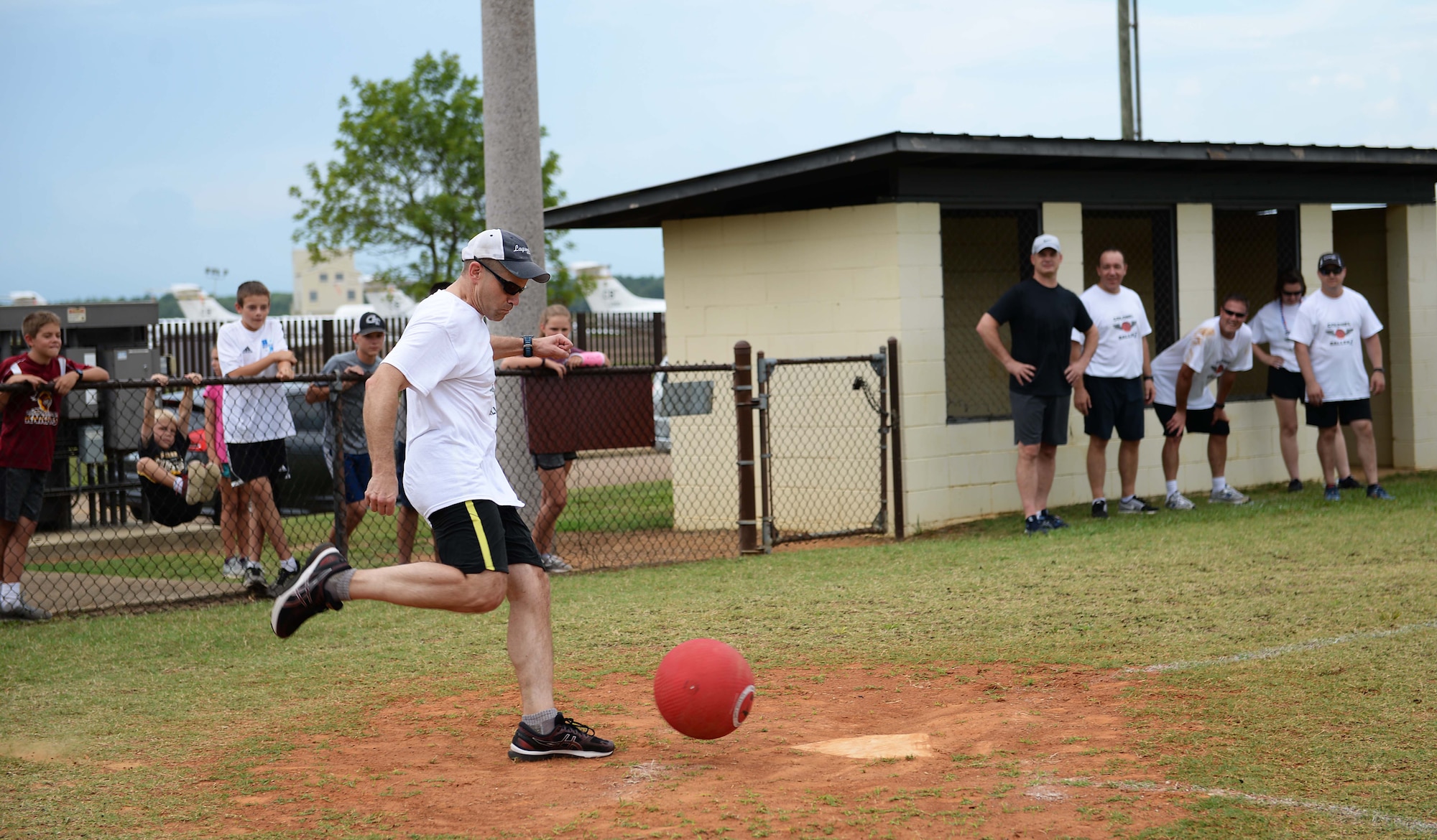 Col. William Denham, 14th Flying Training Wing vice commander, kicks a ball during the Eagles versus the Chiefs kickball game July 3, 2018, at BLAZE Fest on Columbus Air Force Base, Miss. In a close competitive match, the eagles defeated the chiefs 2-1. (U.S. Air Force photo by Airman 1st Class Hannah Bean)