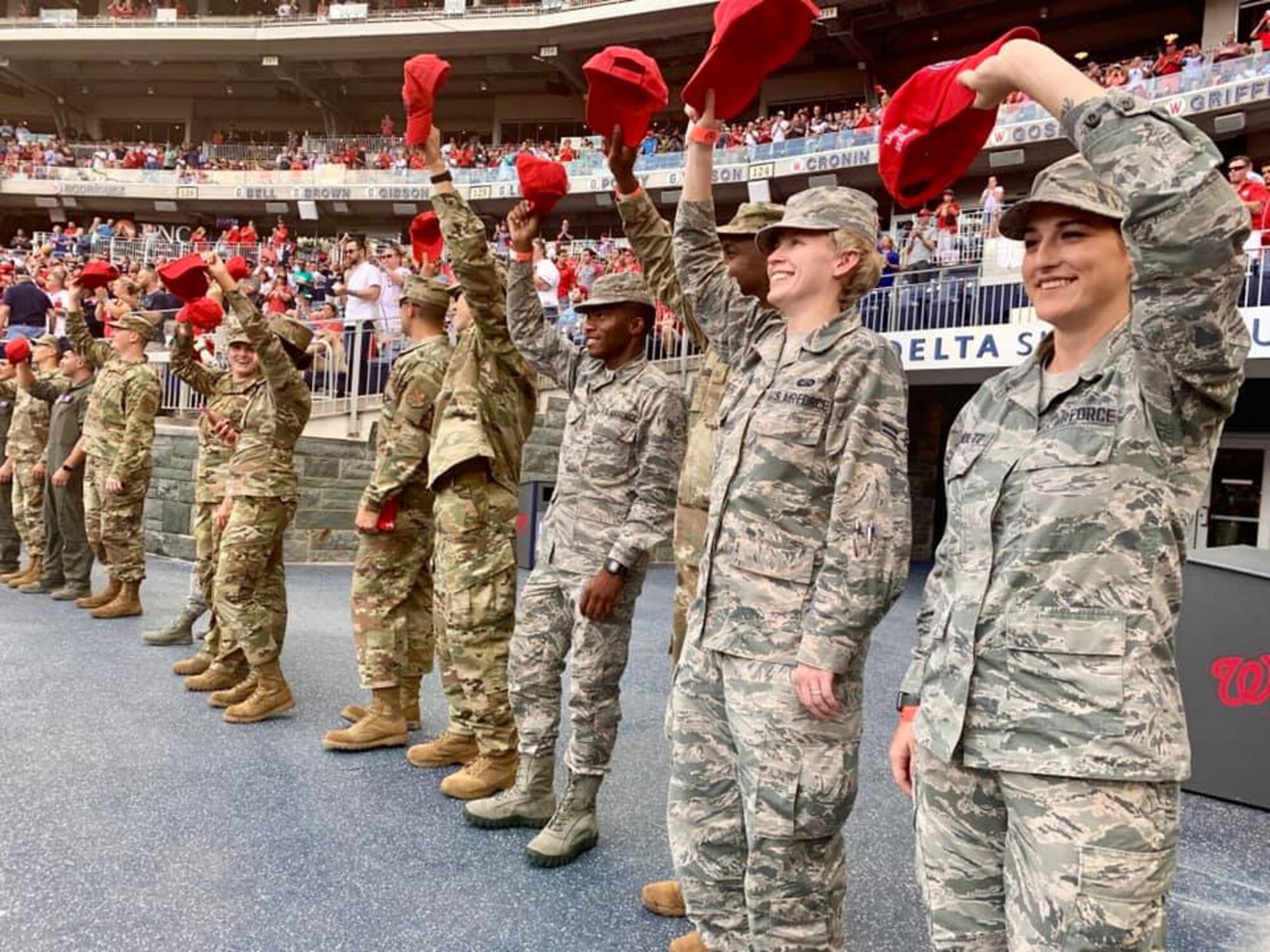 Air Force District of Washington Airmen wave their red baseball caps in front of the Delta Sky360 Club as part of the Salute to Service event July 25. The Washington Nationals offer year-round experiences as thanks and quality-of-life outreach for service members and their families in the Washington region. Around the third inning, honorees are recognized on the NatsHD scoreboard and receive a standing ovation from fans. The Colorado Rockies defeated the Nats 8-7. The next Salute to Service event takes place Aug. 13 against the Cincinnati Reds.