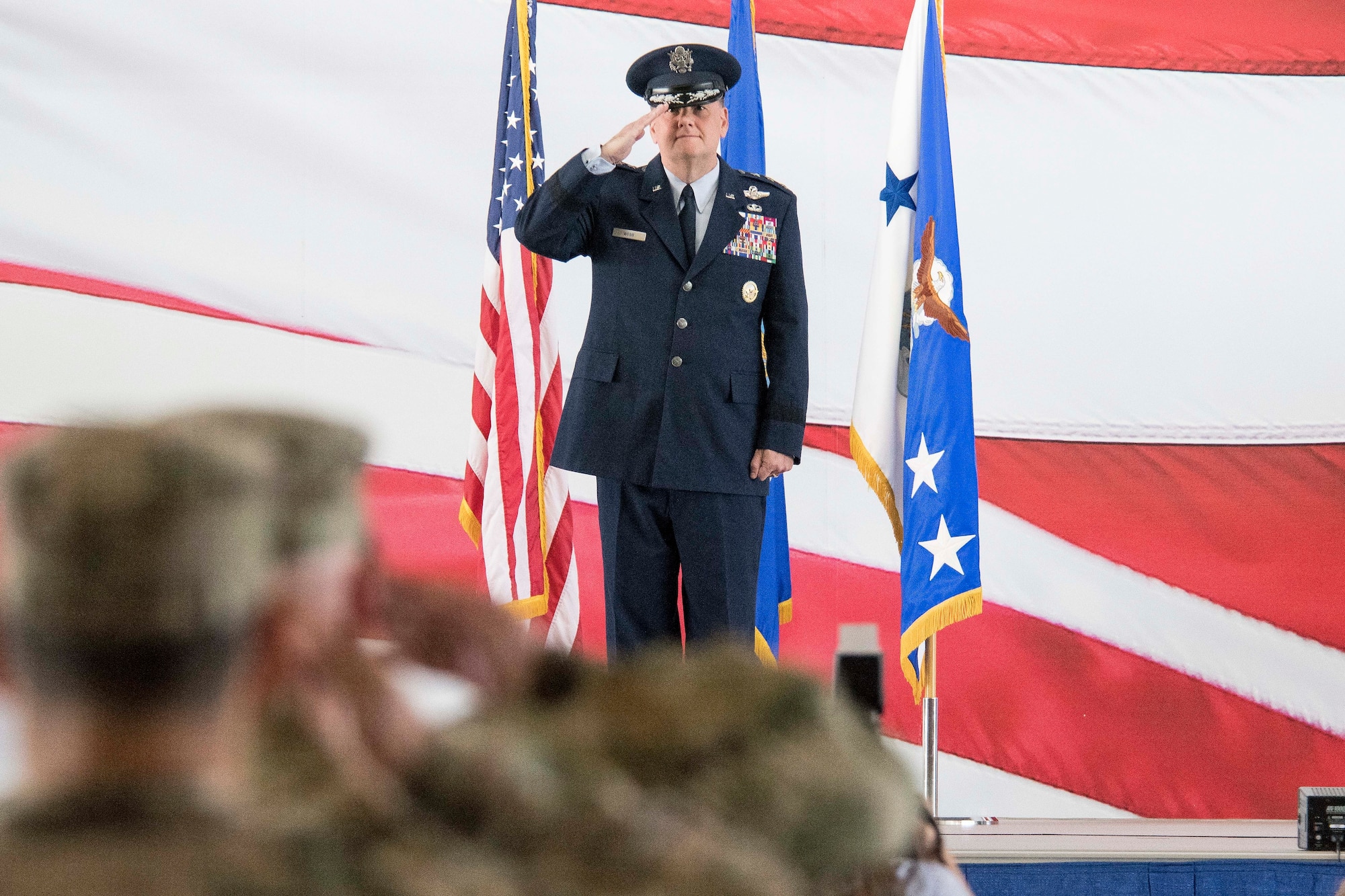 U.S. Air Force Lt. Gen. Brad Webb, commander of Air Education and Training Command, renders his first salute to the men and women of the First Command during AETC’s change of command ceremony at Joint Base San Antonio-Randolph, Texas, July 26, 2019. AETC operates more than 1,400 trainer, fighter and mobility aircraft, 23 wings, 10 bases and five geographically separated groups. (U.S. Air Force photo by Sean M. Worrell)