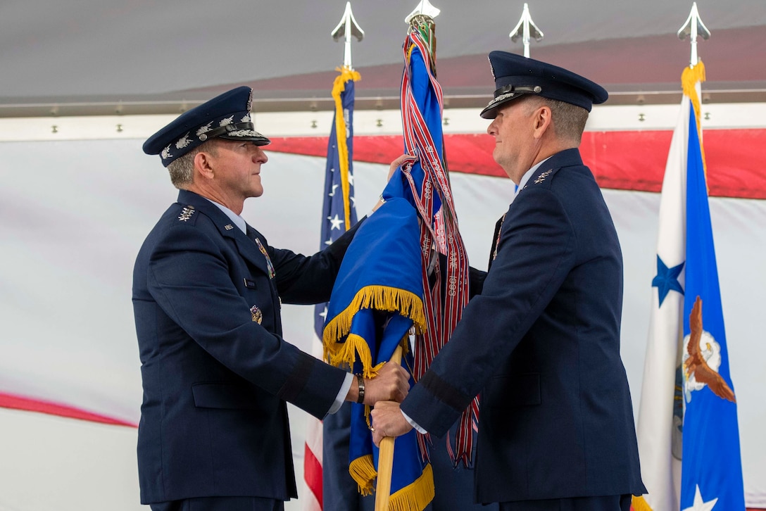 U.S.  Air Force Chief of Staff Gen. David L. Goldfein presents the Air Education and Training Command guidon to Lt. Gen. Brad Webb, new commander of AETC, during a change of command ceremony July 26, 2019, at Joint Base San Antonio-Randolph, Texas. Webb, a 1984 graduate of the U.S. Air Force Academy, is a command pilot with more than 3,700 flying hours, including 117 combat hours in Afghanistan, Iraq and Bosnia. (U.S. Air Force photo by Sabrina Fine)