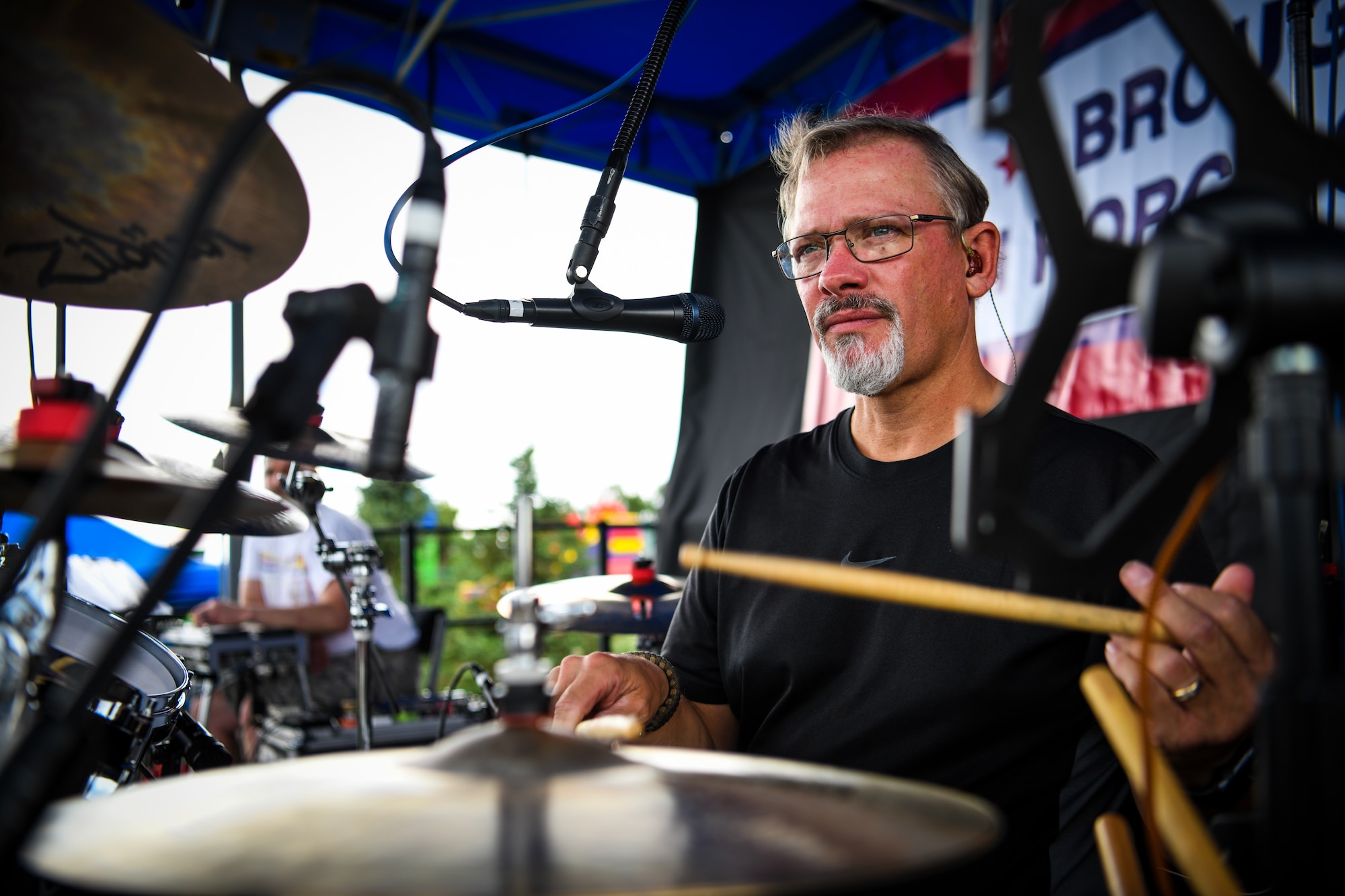 A drummer for a Ryan Daniel band practices the snare and keeping tempo before performing at Fun Fest, July 25, 2019 on Buckley Air Force Base, Colo. Various agencies and partners sponsored Fun Fest, providing service members and families with free food, music, and over 50 different activities and games to enjoy. (U.S. Air Force photo by Airman 1st Class Michael D. Mathews)