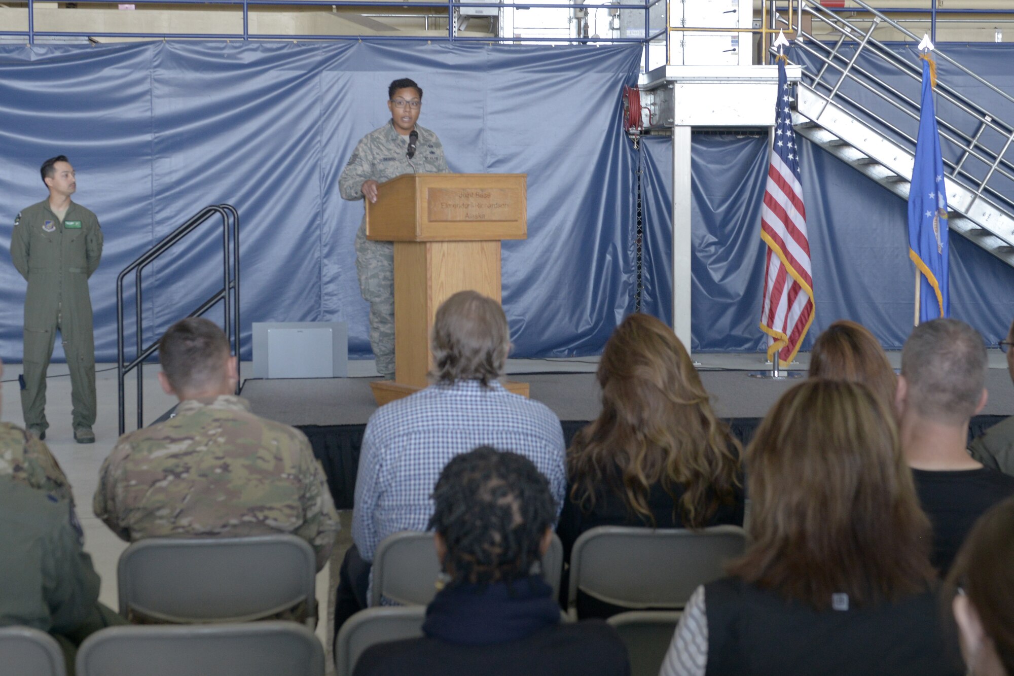 U.S. Air Force Tech. Sgt. Samoana Ingram, 962nd Airborne Air Control Squadron group training manager, gives the history of the 3rd Wing during the opening ceremony for the 3rd Wing’s 100th anniversary celebration on Joint Base Elmendorf-Richardson, Alaska, July 25, 2019