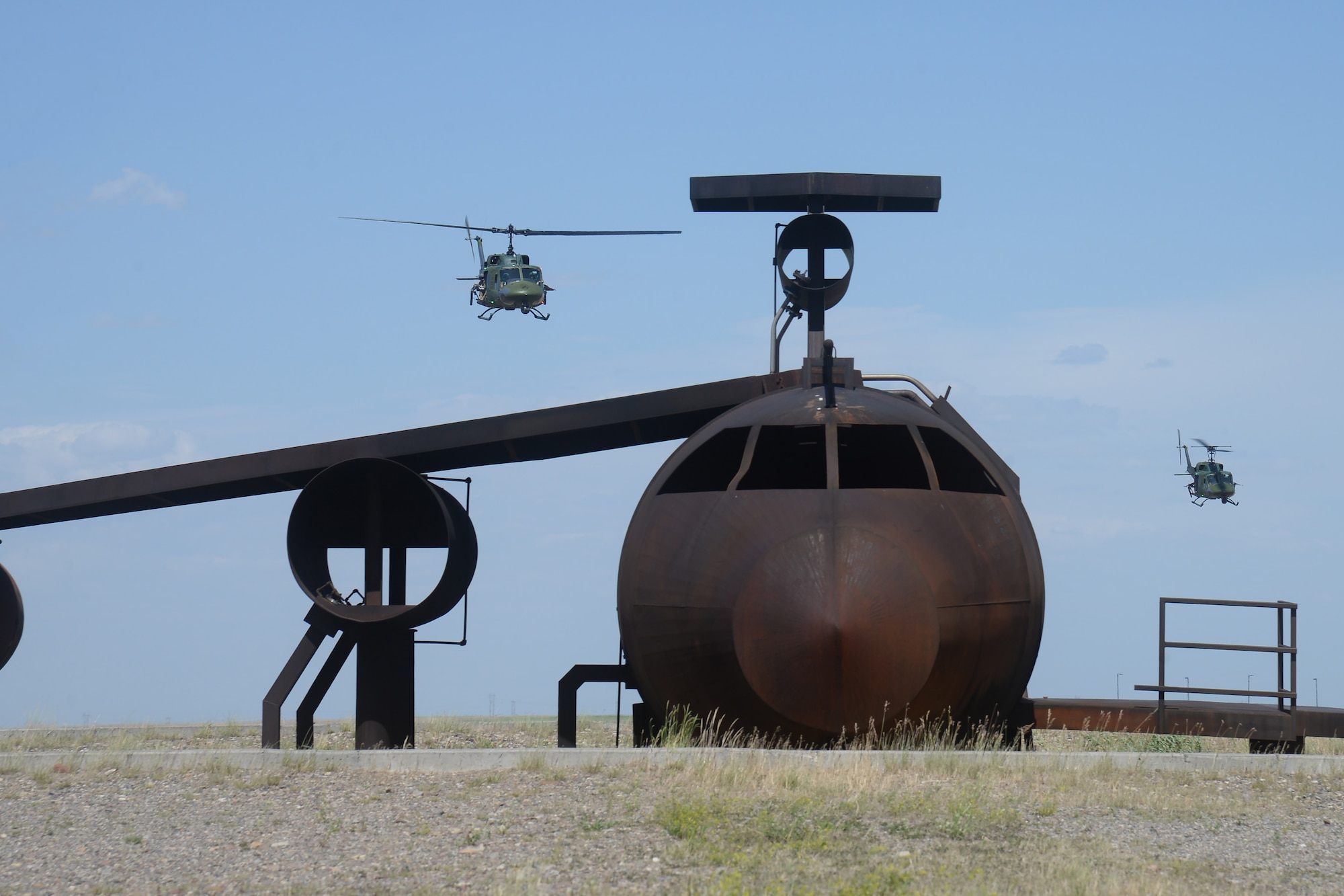 Two UH-1N Iroquios helicopters from the 40th Helicopter Squadron perform a show-of-force maneuver during training for the annual Global Strike Challenge July 24, 2019, at Malmstrom Air Force Base, Mont.