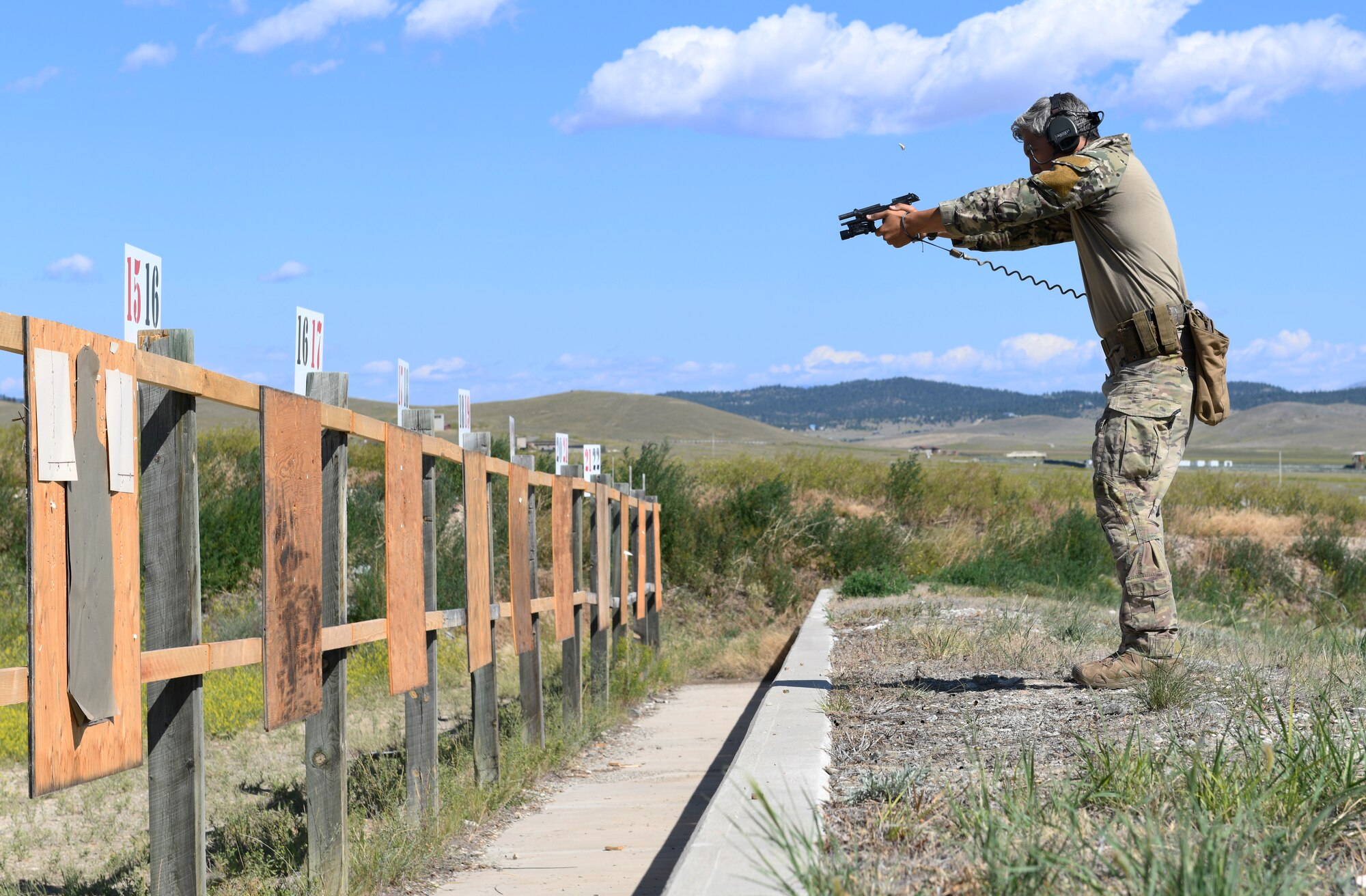 Senior Airman Tyler Arevalo, 741st Missile Security Forces Squadron tactical response force member, fires an M9 pistol July 24, 2019, at Fort Harrison, Mont.