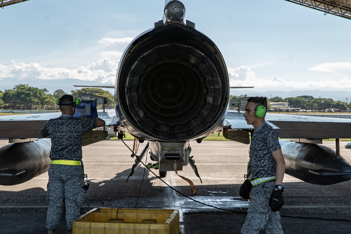Members of the Colombian Air Force perform maintenance checks on a Kfir fighter jet during Exercise Relámpago in Barranquilla, Colombia, July 17, 2019.