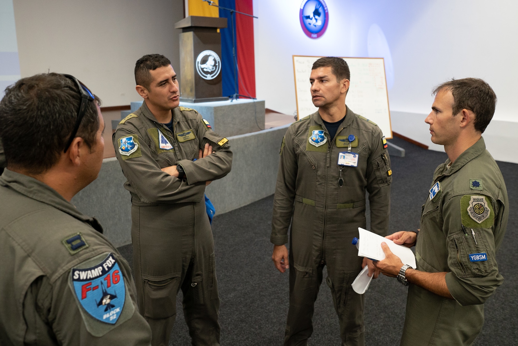Lt. Col. Stephen Kaminski, 169th Fighter Wing F-16 pilot, speaks with aircrew from the Colombian Air Force during Exercise Relámpago in Barranquilla, Colombia, July 17, 2019.