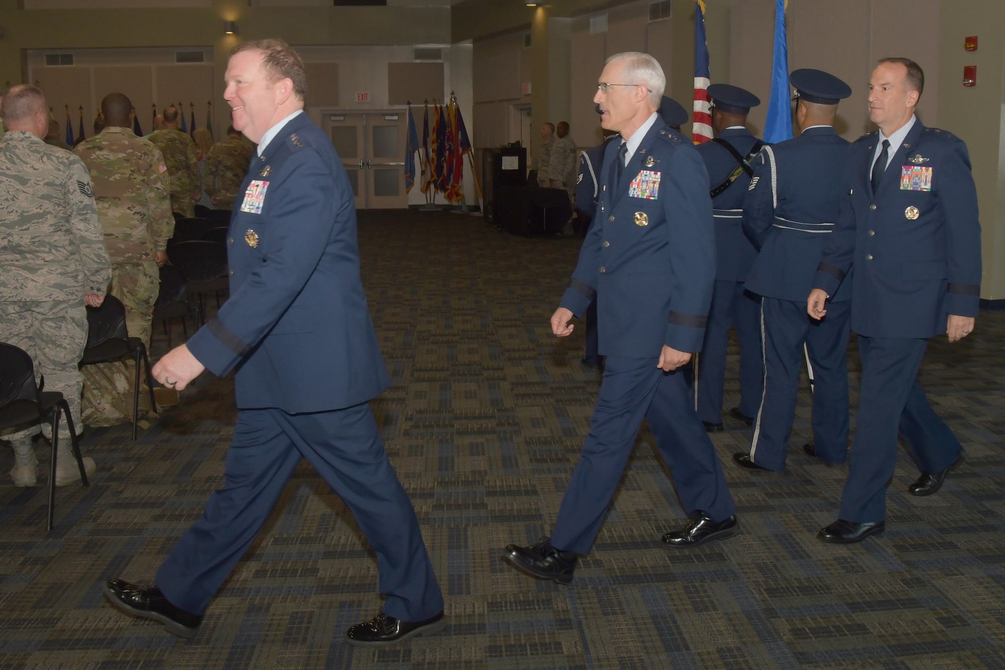 Lt. Gen. Richard W. Scobee, Chief of Air Force Reserve and Air Force Reserve commander, Maj. Gen. Craig L. La Fave, outgoing commander of the 22nd Air Force and Maj. Gen. John P. Healy, incoming commander of the 22nd Air Force, enter a change of command ceremony, July 23, 2019.