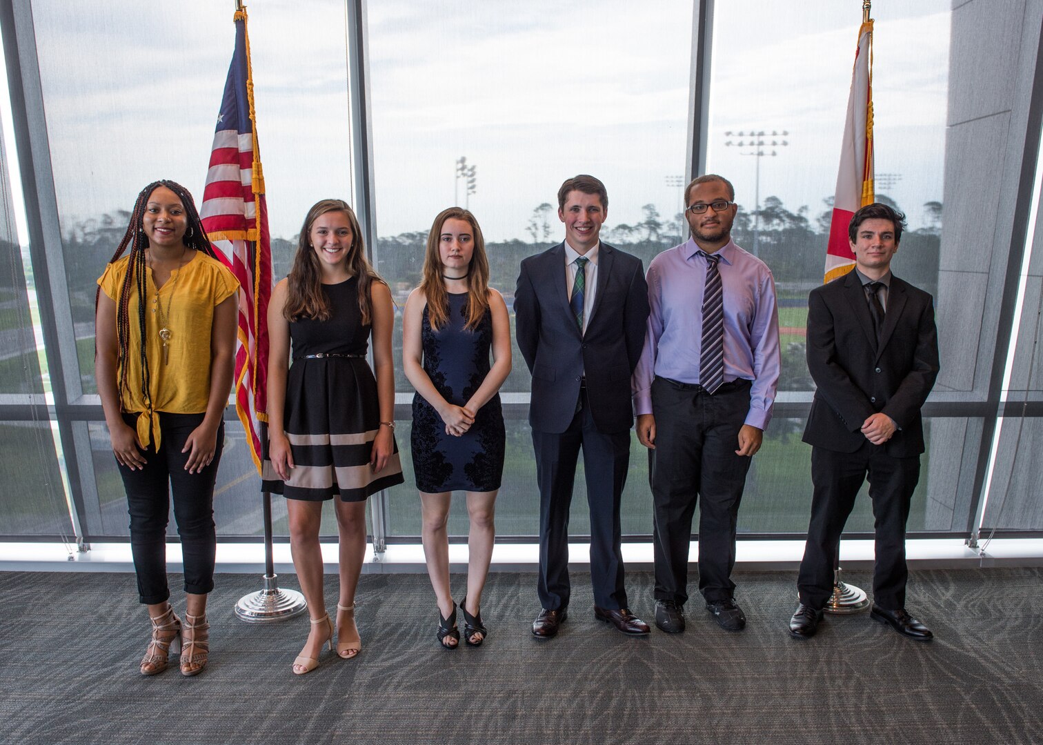 Science and Engineering Apprenticeship Program interns pose for a photo presentations to mark the completion of their eight-week summer internship program at Naval Surface Warfare Center Panama City Division July 26.