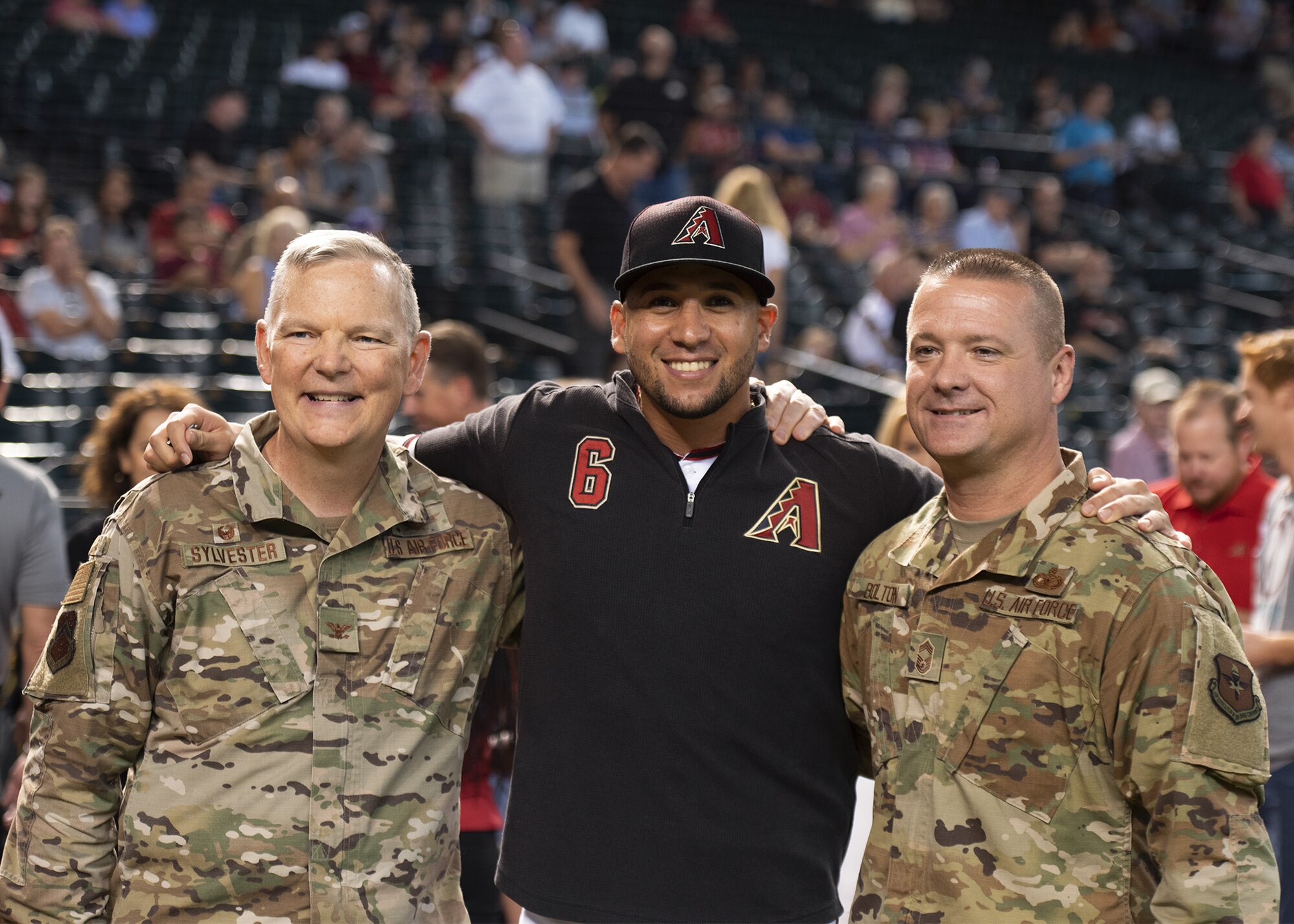 Col. Robert Sylvester, 56th Mission Support Group commander; David Peralta, Arizona Diamondbacks left fielder; and Chief Master Sgt. Donnie Bolton, 56th Mission Support Group superintendent pose for a photo July 24, 2019, at Chase Field in Phoenix.