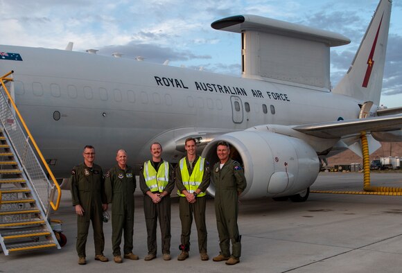 Royal Australian Air Force No. 2 Squadron Wing Commander Jason Brown, Gen. Stephen W. Wilson U.S. Air Force Vice Chief of Staff, RAAF E-7A Wedgetail crew, and Air Commodore Terry Vanharen, Australian Air Attache’ pose for a photo on the flightine at Nellis Air Force Base, Nev., July 22, 2019 before a Red Flag mission. Red Flag 19-3 increases interoperability between the U.S. and its allies and across the joint force as Airmen train together against high-end, realistic scenarios. (U.S. Air Force photo by Airman 1st Class Dwane R. Young)