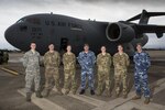 Royal Australian Air Force and US Air Force Technicians on the Tools Together