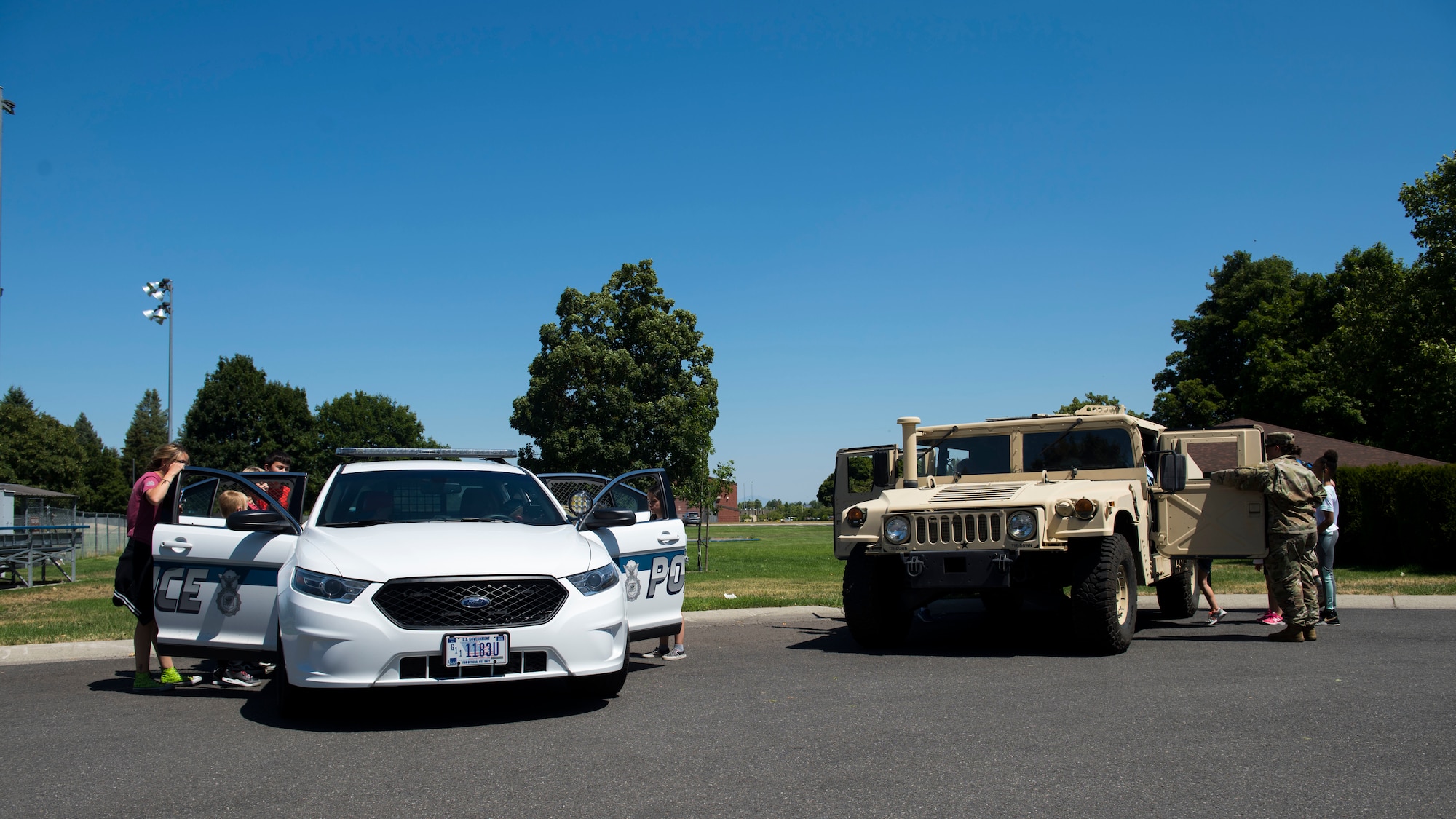 Vehicles from the 92nd Security Forces Squadron are displayed for kids from Fairchild’s Youth Center during the Summer Youth Fair, at Fairchild Air Force Base, Washington, July 25, 2019. Members from Fairchild’s 92nd Civil Engineer Squadron Fire Department, Explosive Ordnance Disposal team, 92nd Security Forces Squadron and 92nd Medical Group provided activities and educational exhibits. (U.S. Air Force photo by Airman 1st Class Lawrence Sena)