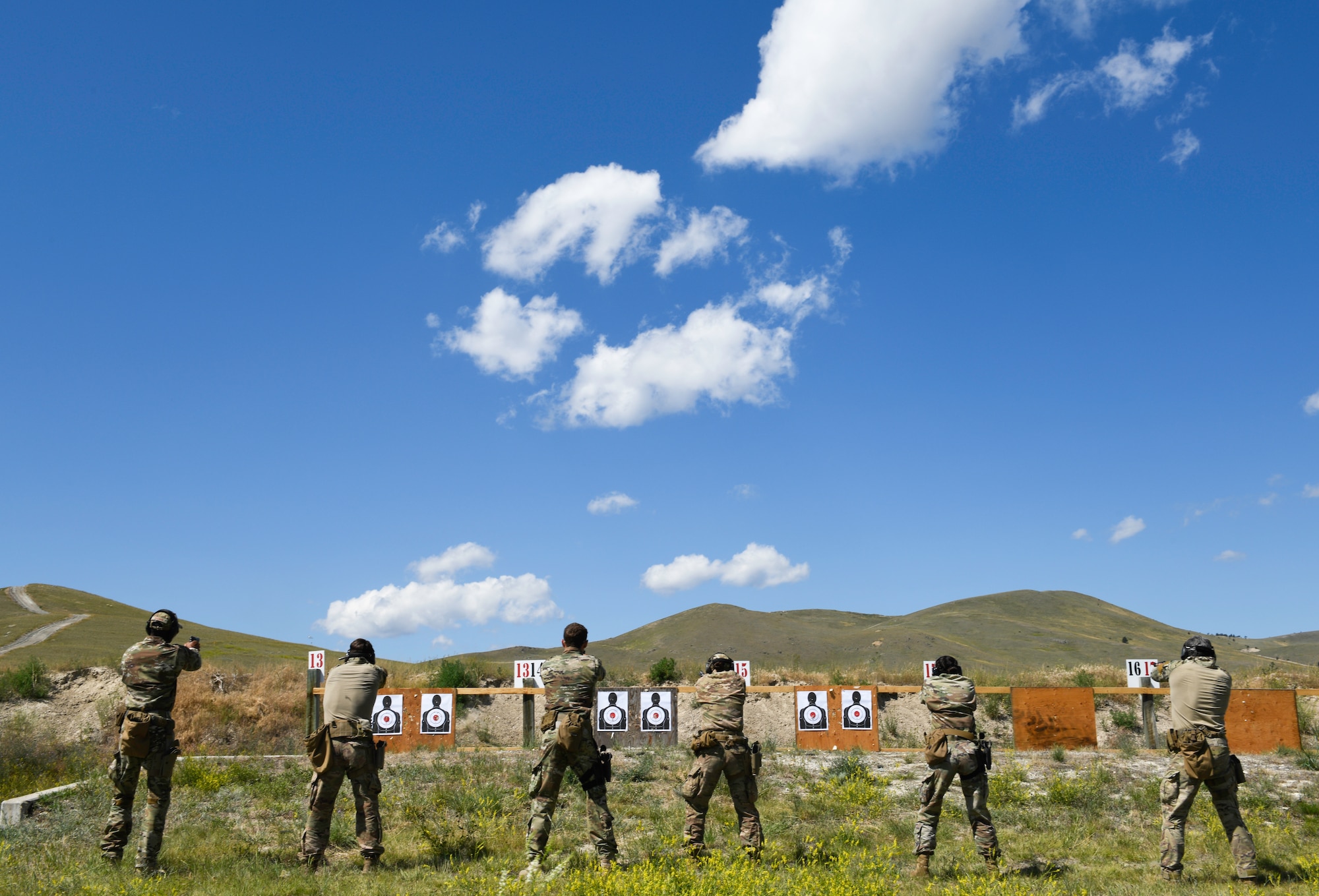 Members of the 341st Security Forces Group Global Strike Challenge team fire M9 pistols July 25, 2019, at Fort Harrison, Mont.