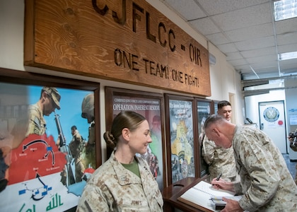 Marine Corps Gen. Joe Dunford, chairman of the Joint Chiefs of Staff, signs the guestbook at Headquarters, Operation Inherent Resolve, during a visit to Baghdad, Iraq, July 26, 2019.