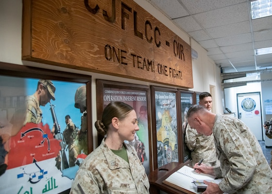 Marine Corps Gen. Joe Dunford, chairman of the Joint Chiefs of Staff, signs the guestbook at Headquarters, Operation Inherent Resolve, during a visit to Baghdad, Iraq, July 26, 2019.