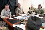 Marine Corps Gen. Joe Dunford, chairman of the Joint Chiefs of Staff, meets with Army Lt. Gen. Paul LaCamera, commander, Operation Inherent Resolve, during a visit to Baghdad, Iraq July 26, 2019.