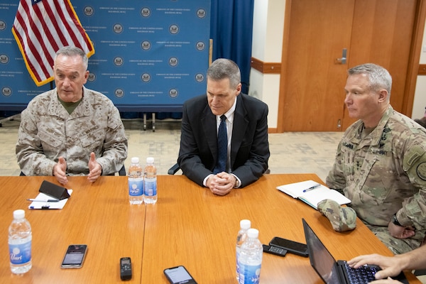 Marine Corps Gen. Joe Dunford, chairman of the Joint Chiefs of Staff, U.S. Ambassador to Iraq Matthew H. Tueller, and Army Lt. Gen. Paul LaCamera, commander, Operation Inherent Resolve, hold a media availability during a visit to Baghdad, Iraq, July 26, 2019.