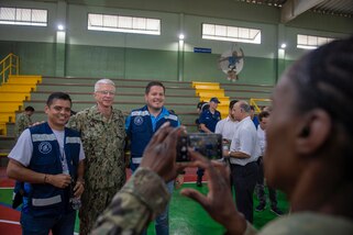 Military personnel pose for a photo.