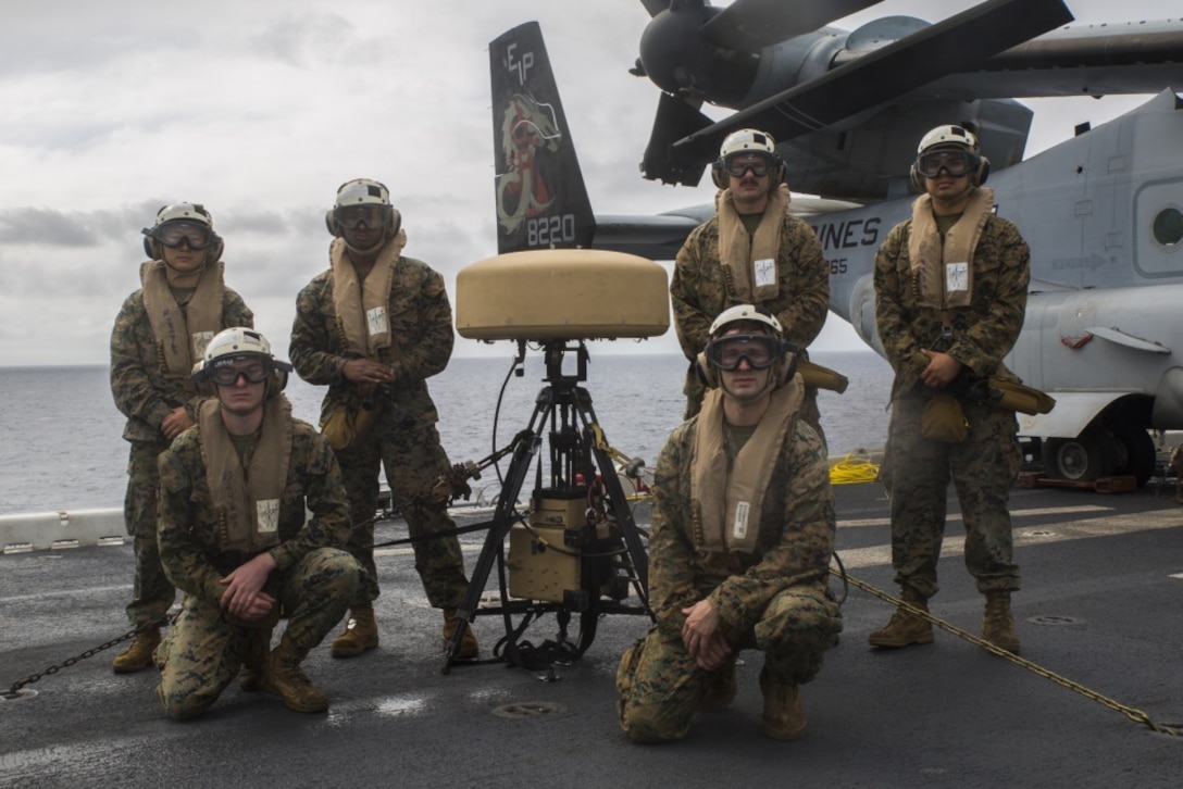 Marines from the Marine Air Traffic Control Mobile Team stand alongside their Tactical Aid to Navigation device, which helps them guide incoming aircraft into the landing zone. Being able to rapidly set up and maintain airstrips and helipads in a deployed environment is one of the many capabilities that Detachment 18 brings to the 31st MEU.