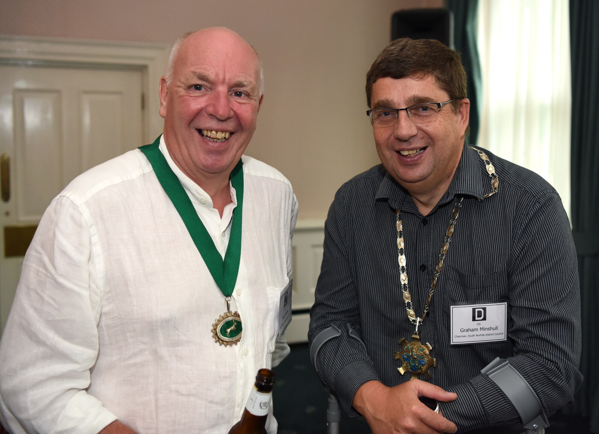 Councillors Roy Brame, Breckland District Council vice chairman, left, and Graham Minshull, South Norfolk District Council chairman, pose for a photo during the New Mayors’ Barbecue at RAF Mildenhall, England, July 27, 2019. The annual event hosted by the U.S. Air Force Col. Troy Pananon, 100th Air Refueling Wing commander, consisted of wing mission and economic impact briefs, a KC-135 Stratotanker nose art-themed lunch and friendly games of cornhole. (U.S. Air Force photo by Airman 1st Class Brandon Esau)